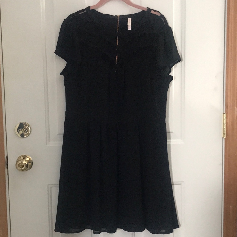 Black cocktail dress, short sleeve, mid thigh & cut out design across the chest